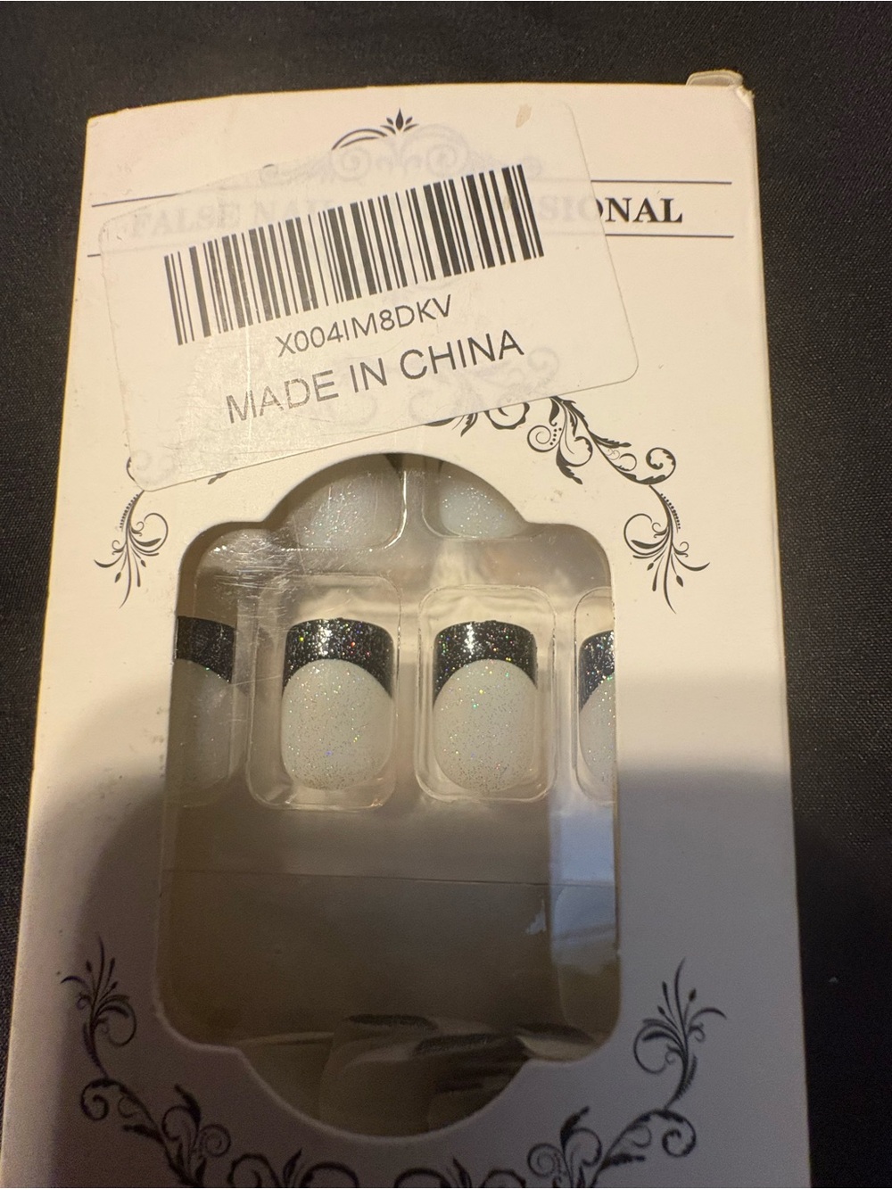 Black French tip press on nails.